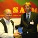 Mr. Herald Voorneveld (Netherlands) presenting a SACMEQ research medal to Professor Servaas Van der Berg (South Africa). 