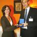  Mr. Herald Voorneveld (Netherlands) presenting a SACMEQ research medal to Ms. Yaël Duthileul (Uruguay).