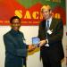 Mr. Herald Voorneveld (Netherlands) presenting a SACMEQ research medal to Mr André Leste (Seychelles).